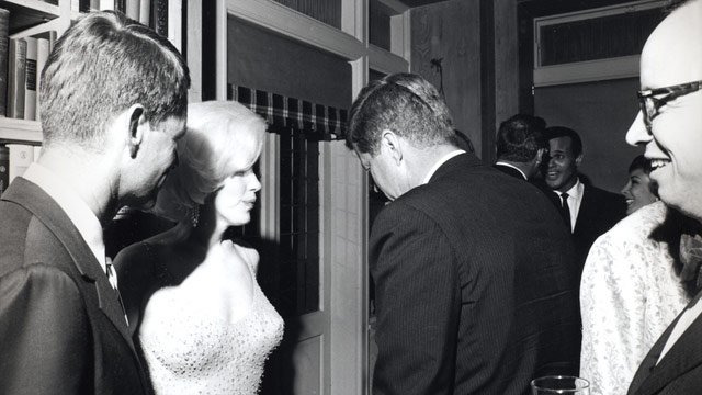Monroe with the two Kennedy brothers. Awwwkwaard... (Source: Wikipedia)